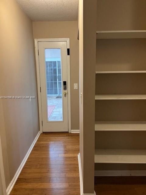 Hall to pool/back patio door from bedrooms