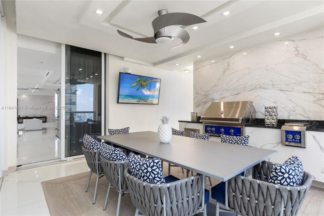 Privet balcony with outdoor kitchen and dining space