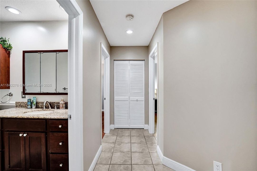 Hall to second bathroom and other bedrooms