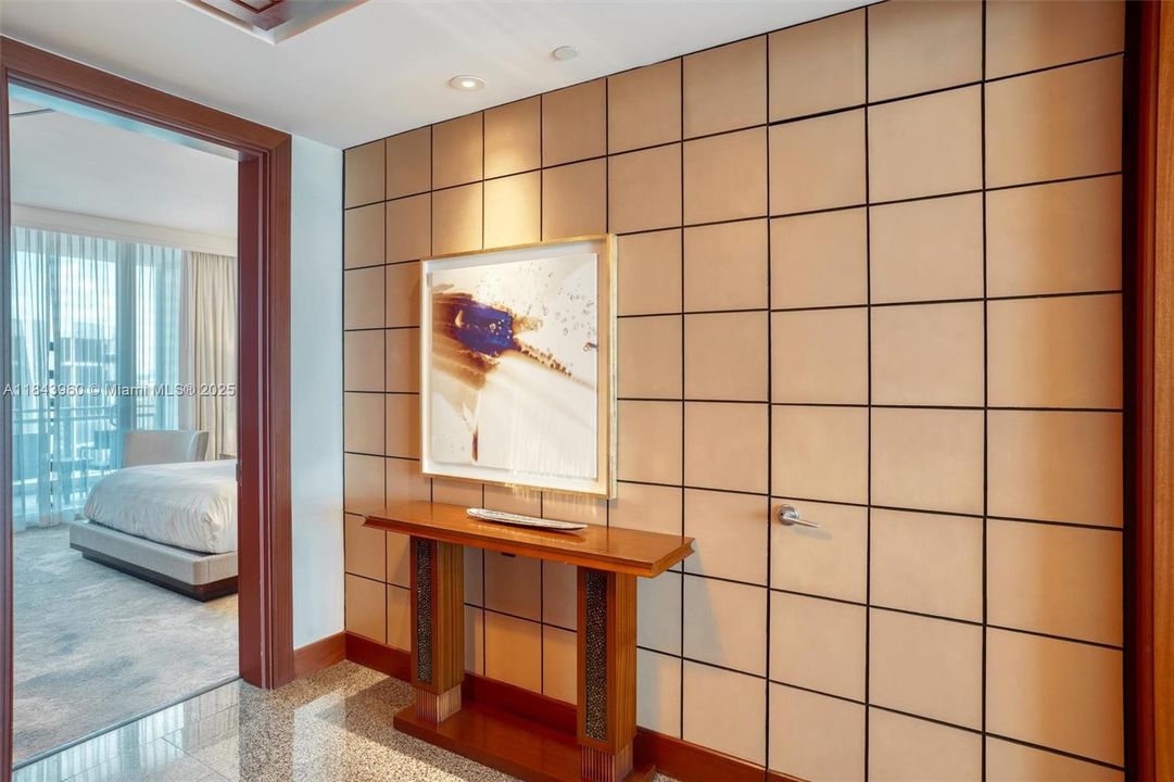 Foyer entrance with bedroom to the left.