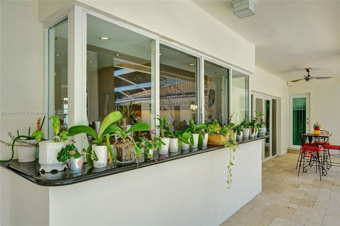 Primary bathroom has the impact door that leads out to the pool.  Have a fabulous day and bbq your favorite meal!