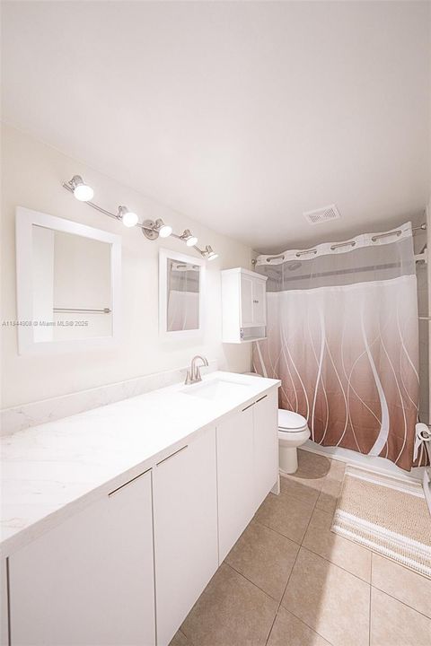 Lots of counter and cabinet space.  Linen closet behind door.