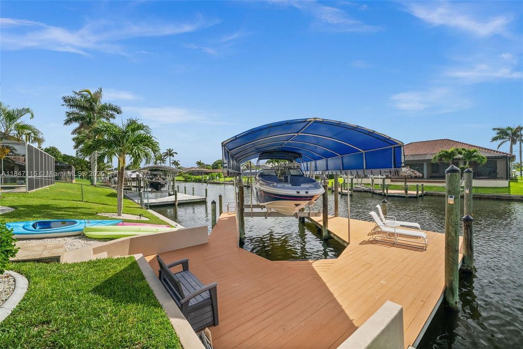 10,000 lb boat lift with a brand new canopy cover.