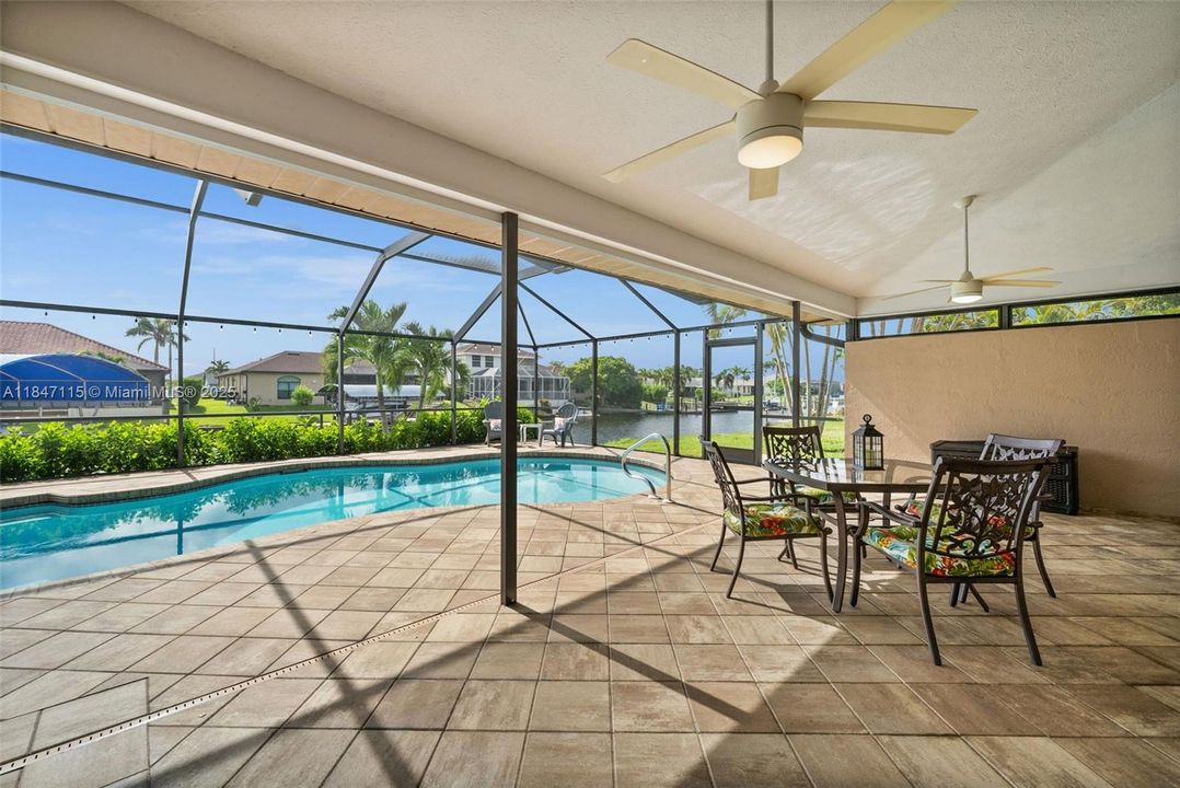 Enjoy pool and canal views from your spacious covered lanai.