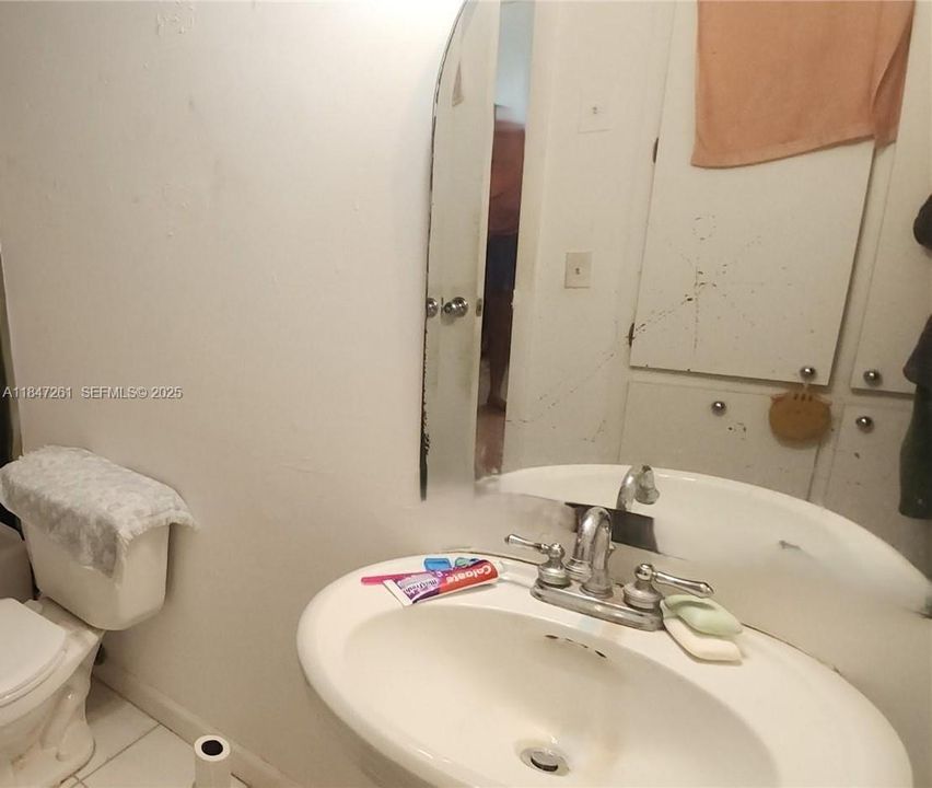 unit has 1 full bathroom with tub-shower and half bathroom for guests