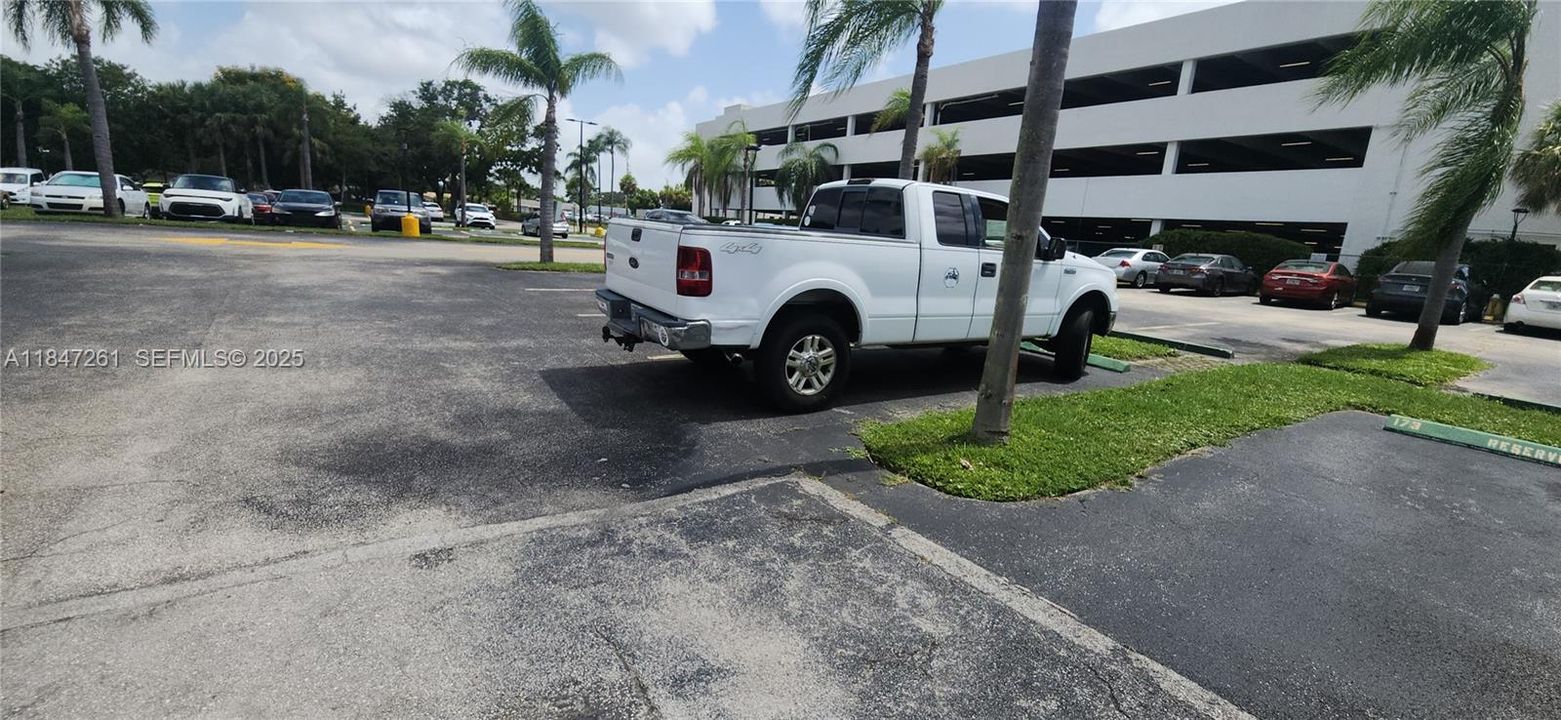 spacious parking spot #172 where white van is