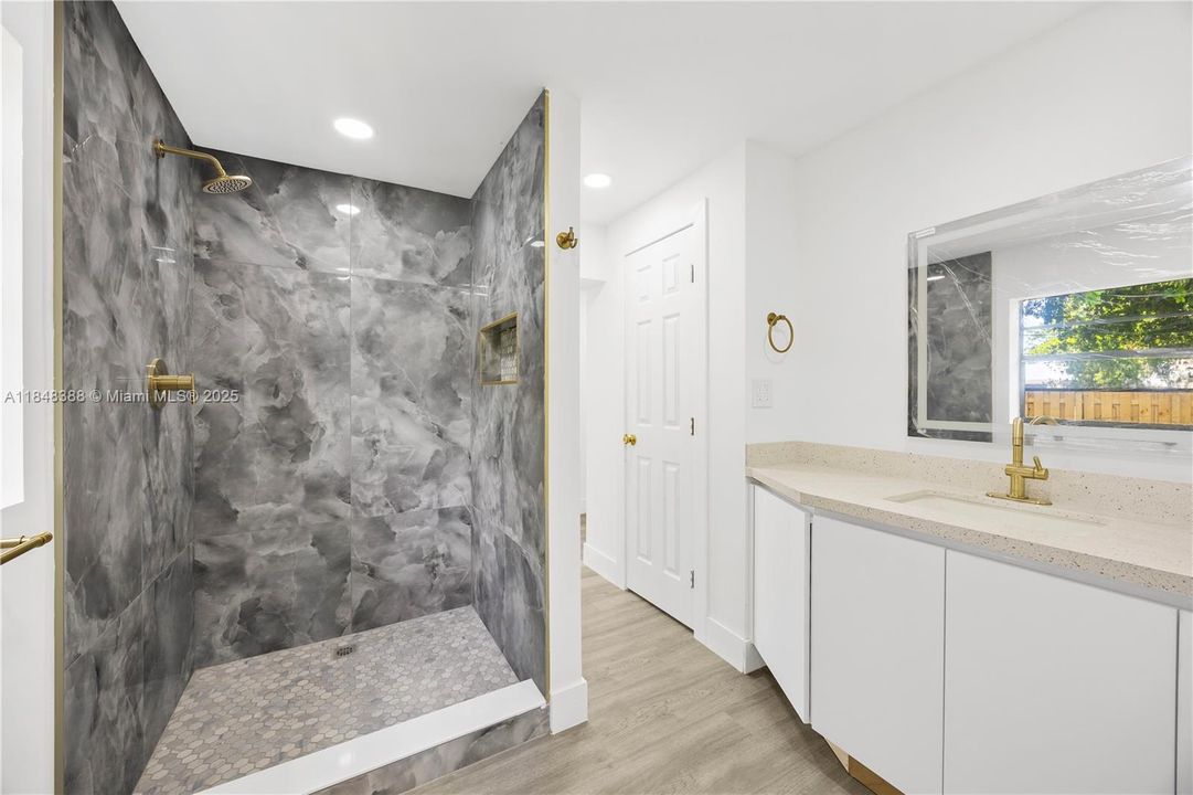 Enclosed Toilet, Beutiful Shower and Vanity. All new