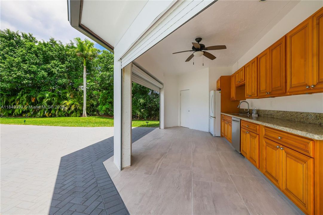 Roll-up shutters for the outdoor kitchen, accordion shutters on all windows, and a roll-up shutter at the apartment entrance.
