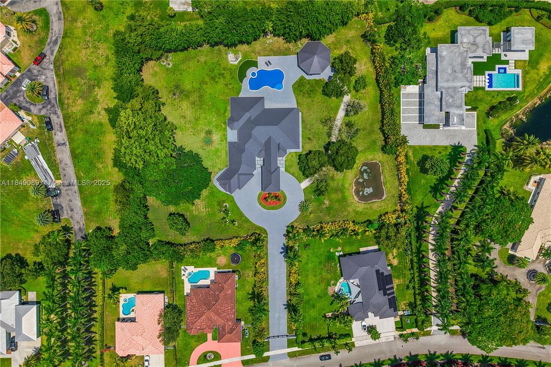 Expansive 2.47-acre fully fenced property for privacy and security.New standing seam metal roof installed on both the main residence and the gazebo.