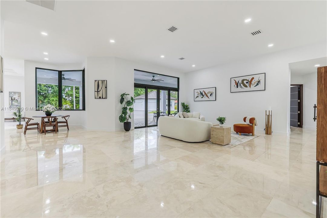 Elegant travertine floors throughout the main residence.