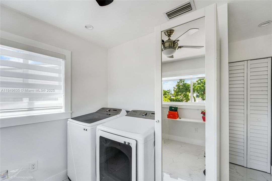 Samsung washer and dryer units with built-in cabinetry.