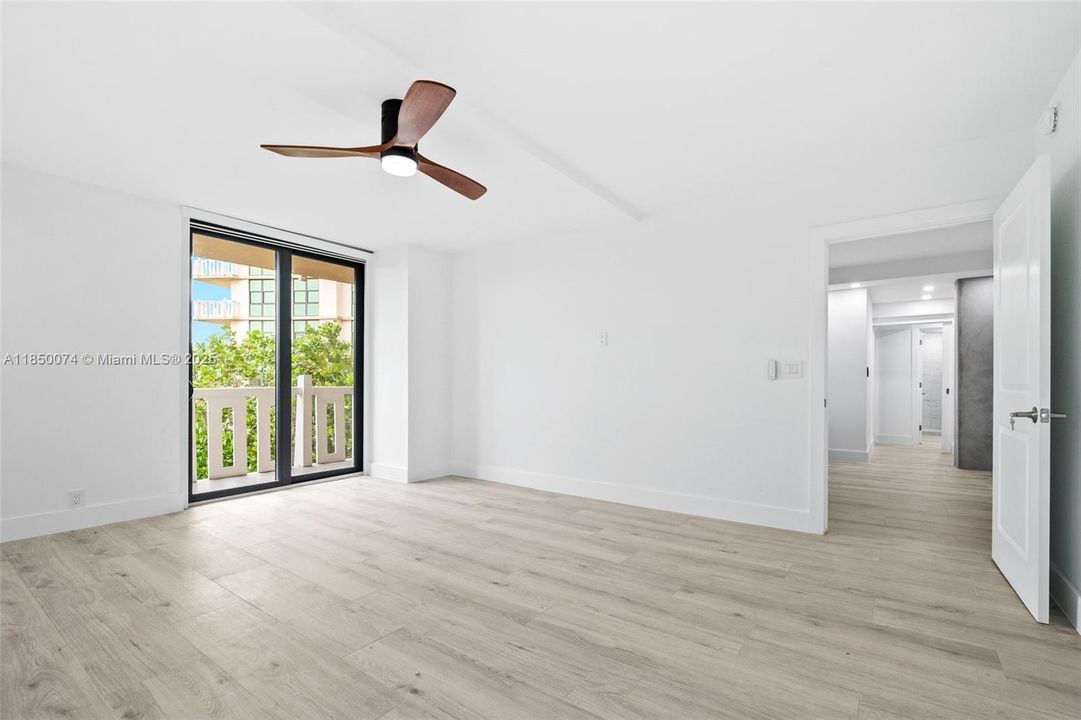 Luxurious master suite features balcony access.