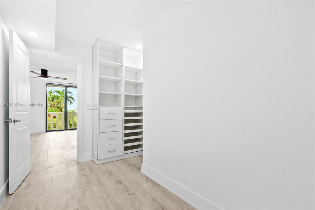 Oversized walk-in closet with versatility for nursery, den, or home office.