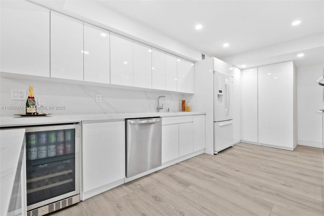 Features top-of-the-line appliances such as a wine cooler, deep sink, and efficient dishwasher.