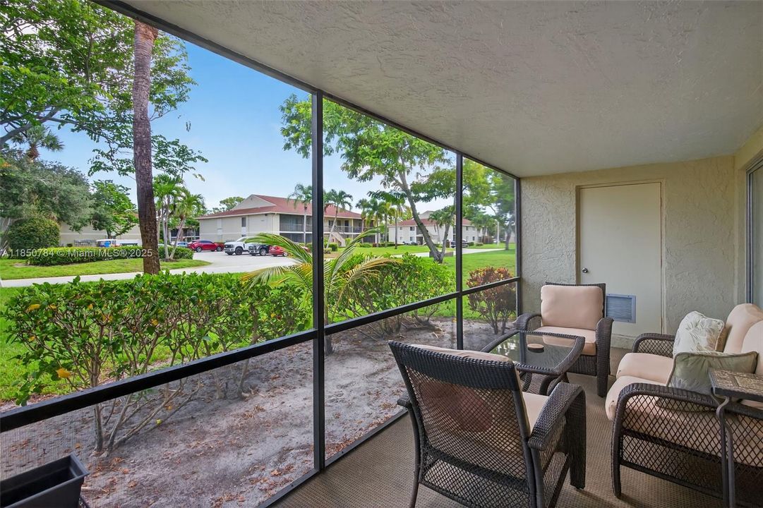 Screened patio with great view of pool area