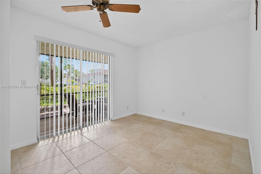Guest bedroom with sliders to screened patio