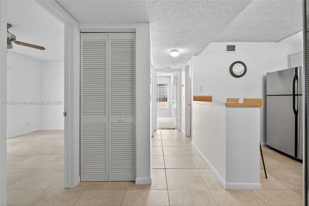 Storage closet near entry and kitchen
