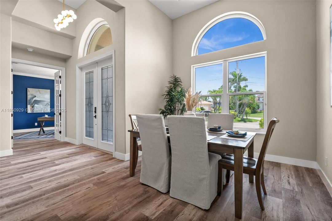 Front entry with view of dinning area and office/flex room/ bedroom