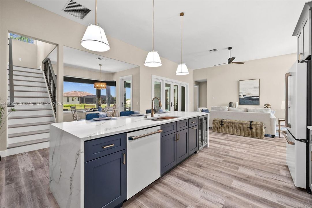 Kitchen with view over the breakfast area and stairs to loft.