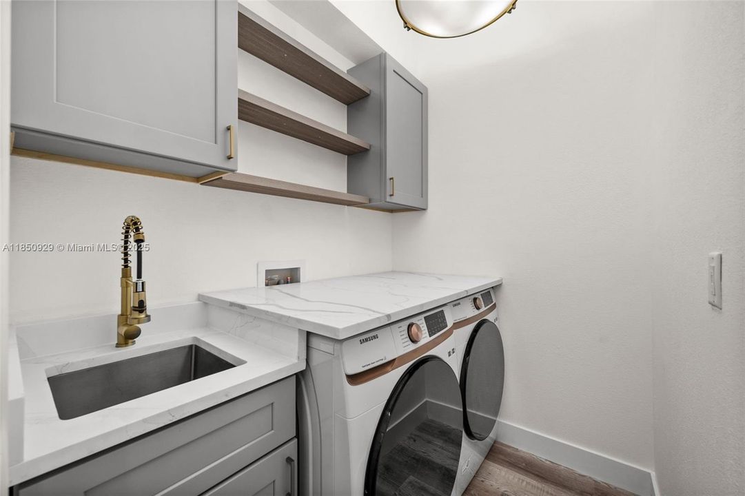 Laundry room with cafe washer/dryer.