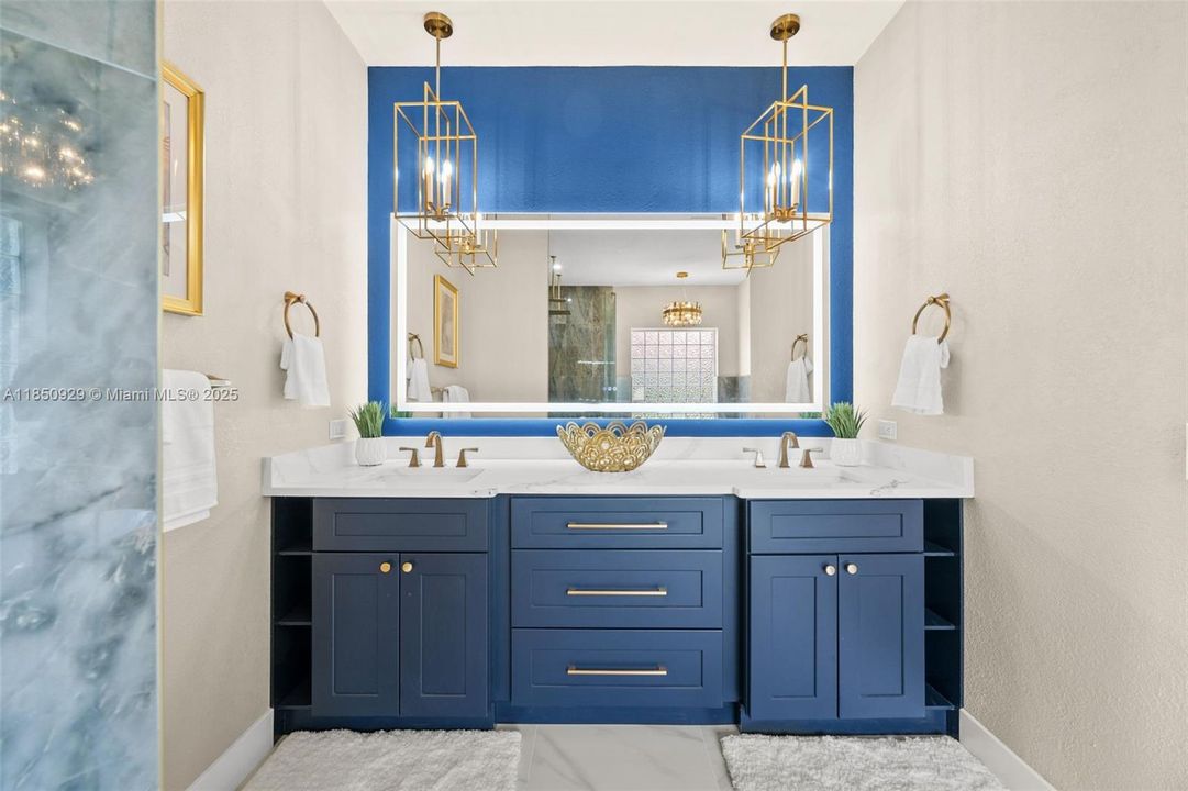 Beautiful primary bath vanity with dual sinks and elegant fixtures.