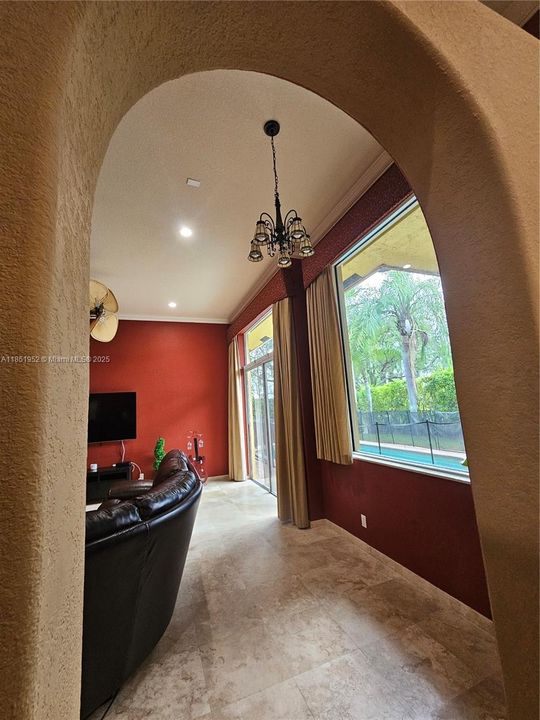 Arched opening between formal living room and family room
