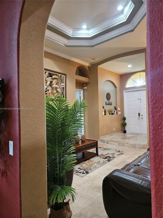 Arched opening between formal living room and family room