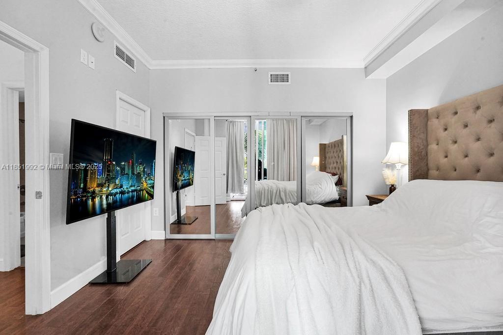 Spacious bedrooms with large windows, wood-style floors, and generous closet space. Peaceful retreat with plenty of natural light in a quiet corner of the city.