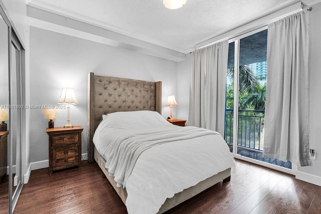 Spacious bedrooms with large windows, wood-style floors, and generous closet space. Peaceful retreat with plenty of natural light in a quiet corner of the city.