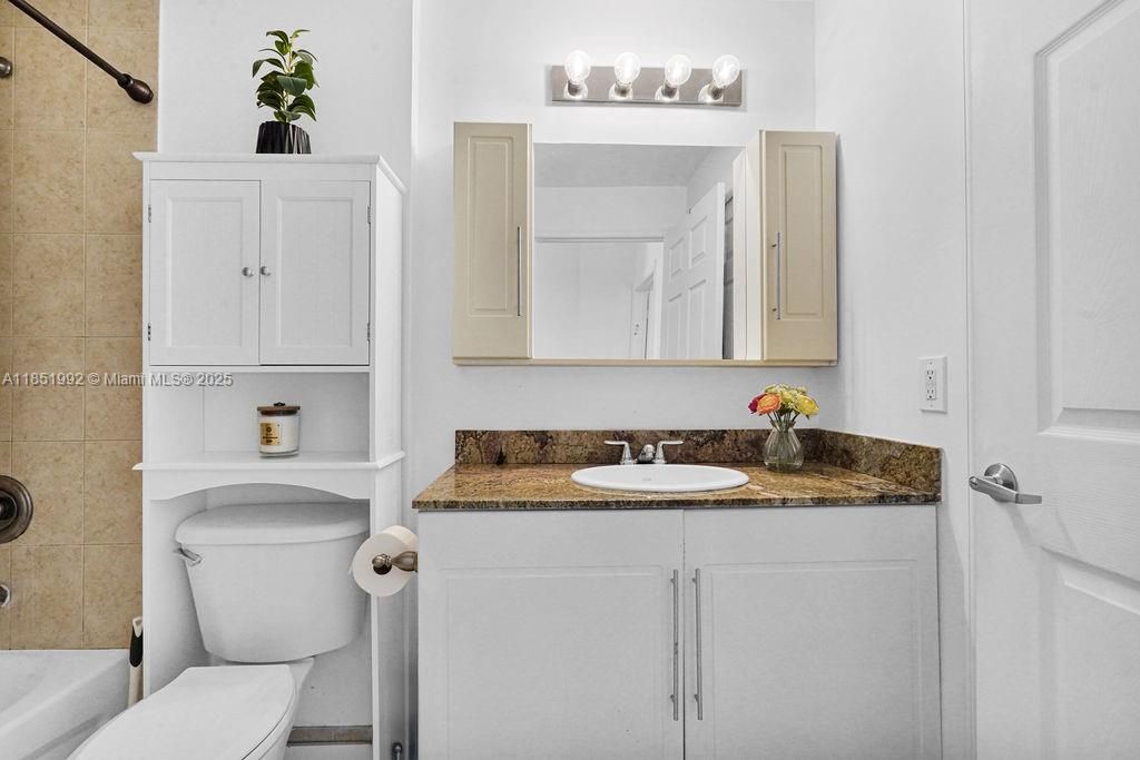 Updated bathroom featuring modern fixtures, bright lighting, and spa-inspired finishes for a relaxing retreat.