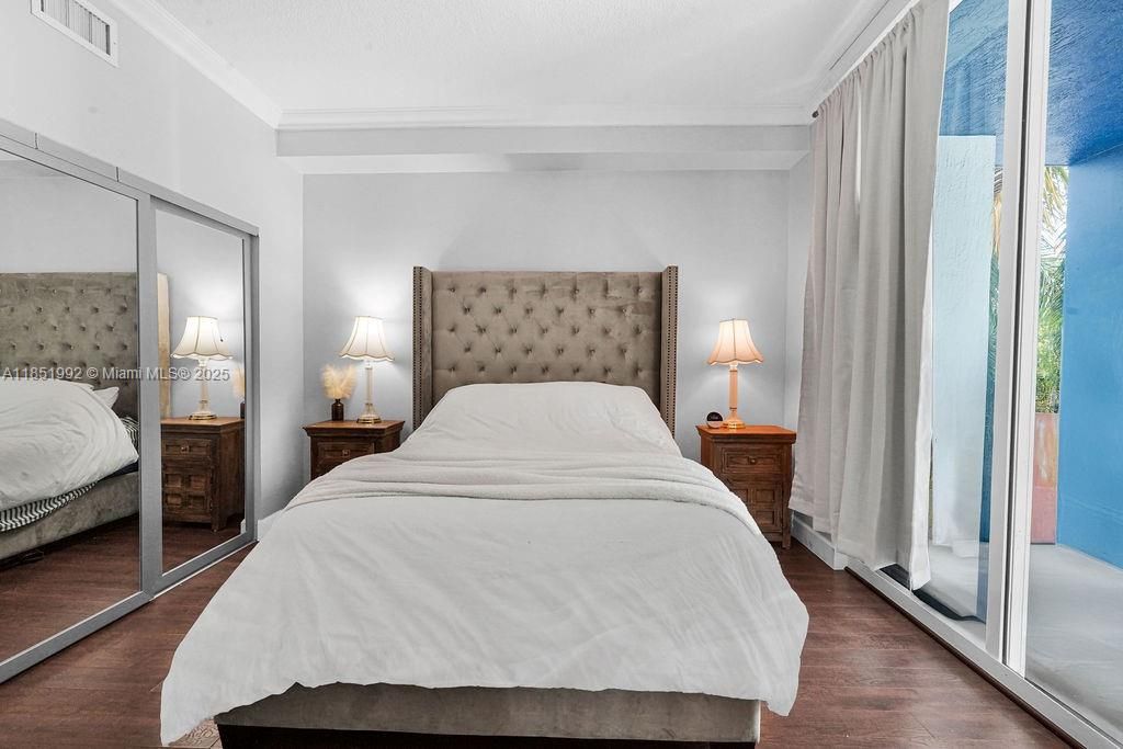 Spacious bedrooms with large windows, wood-style floors, and generous closet space. Peaceful retreat with plenty of natural light in a quiet corner of the city.