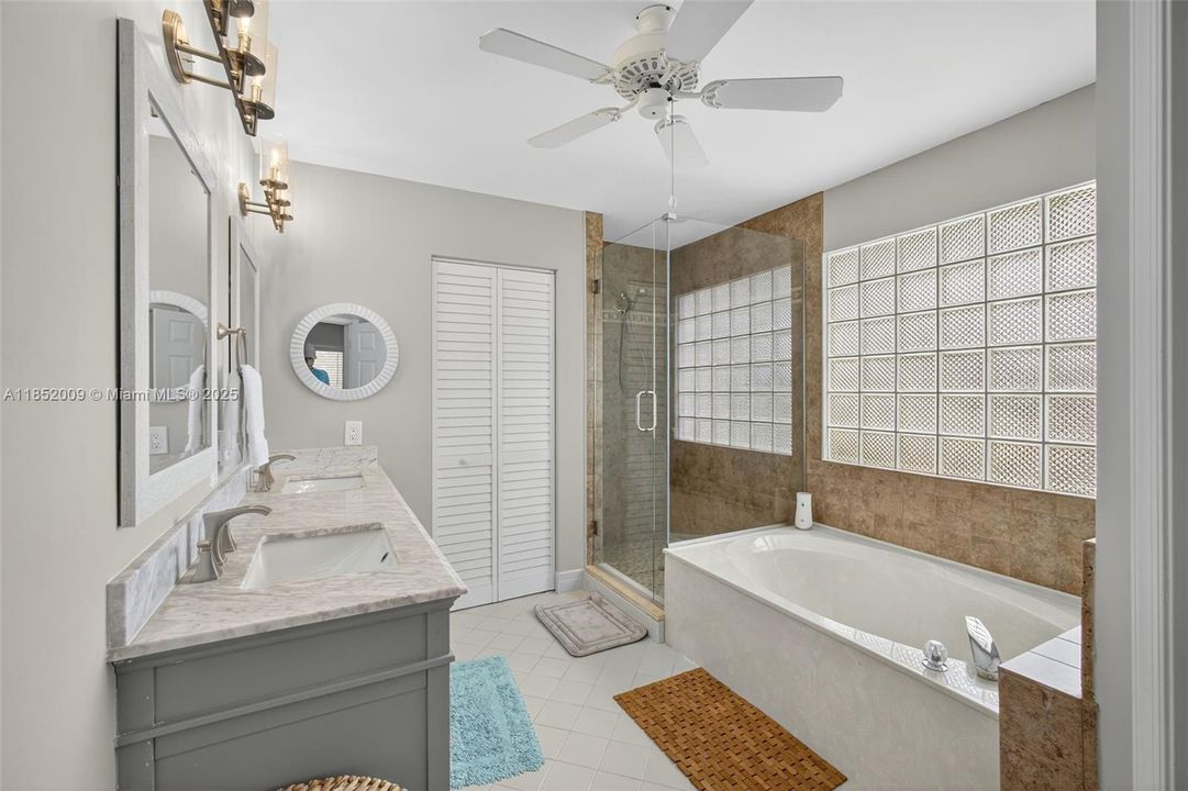His/hers sinks, large linen closet, separate shower and soaker tub