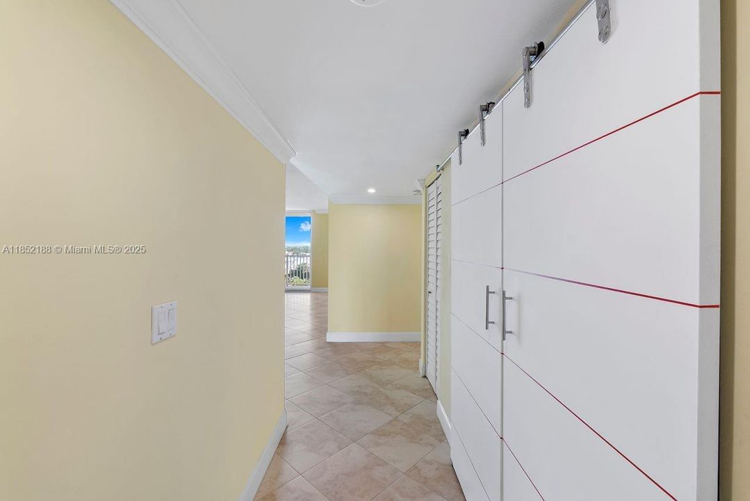 Hallway w/large storage closet