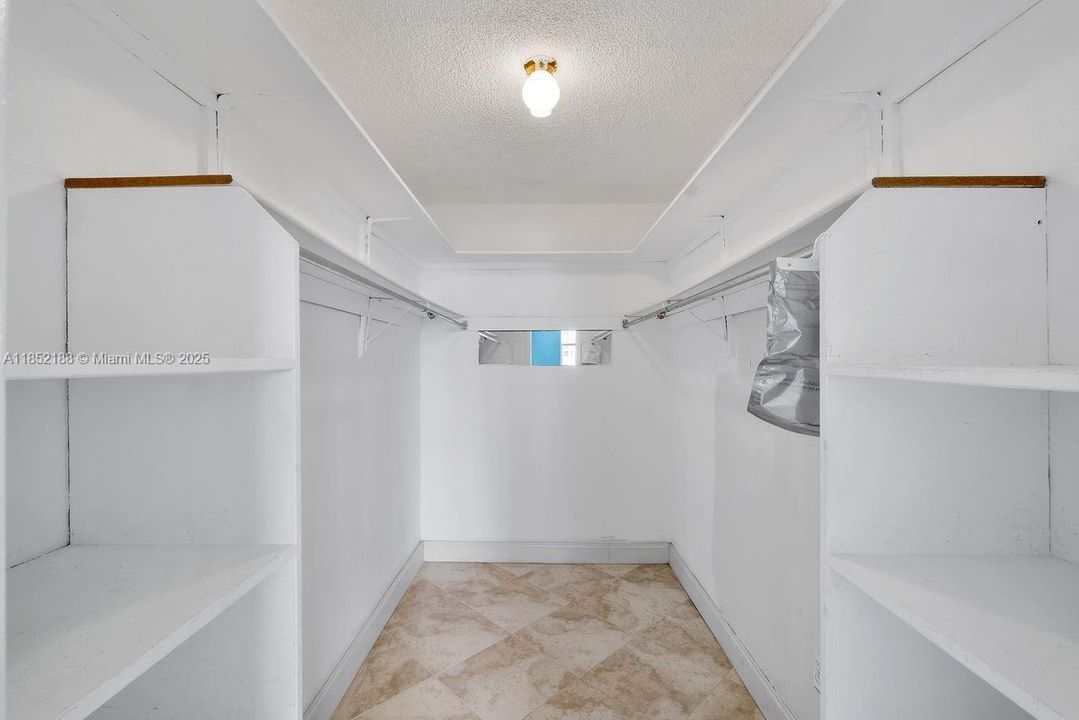 Walk-in closet in primary bedroom