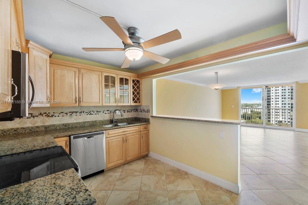 Spacious open kitchen, wood cabinets, granite counters