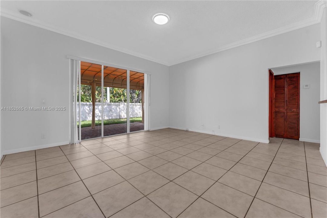 The 2 extra bedrooms and bathroom are to the right of the family room.