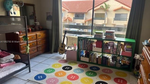 2nd bedroom with view of the pool
