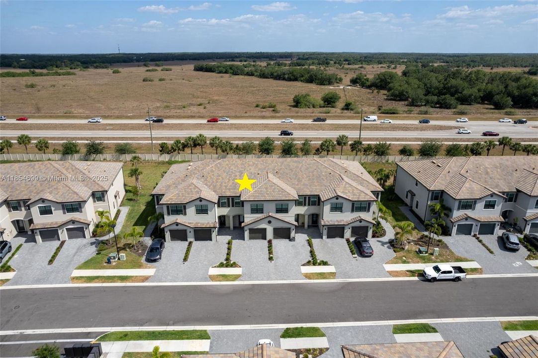 A full hallway bathroom includes a large vanity with granite countertop, tub/shower combo, and linen storage.