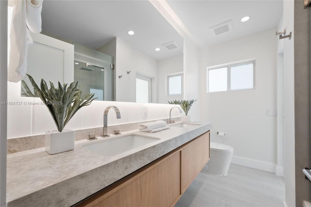 Full bathroom with double sink that can be used as a cabana bath.