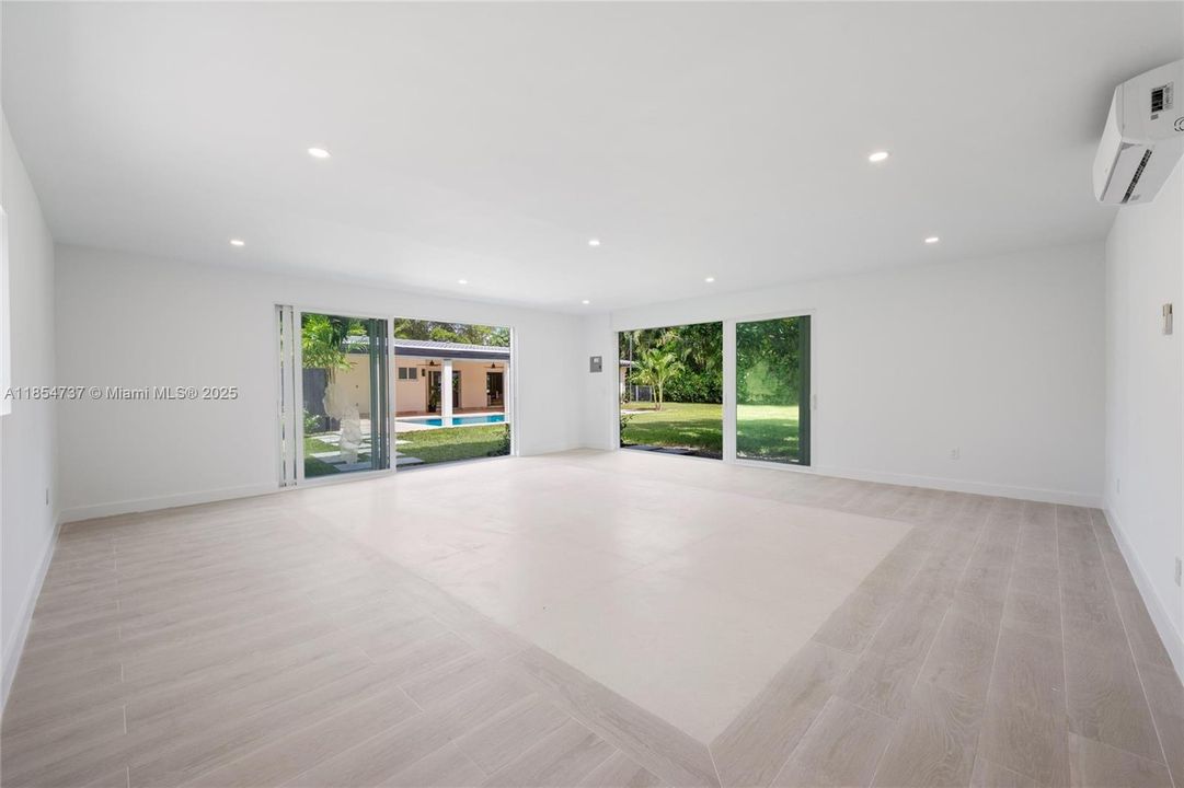 Detached Studio used as playroom and summer kitchen area. Impact windows.