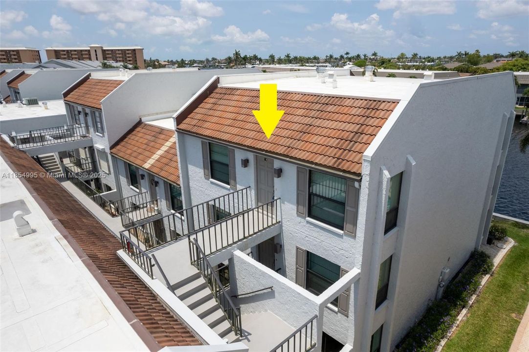 This FULLY FURNISHED 2-BEDROOM, 2-BATHROOM TOP-FLOOR CONDO offers PANORAMIC VIEWS of the 200+ ft wide NAVARRO CANAL