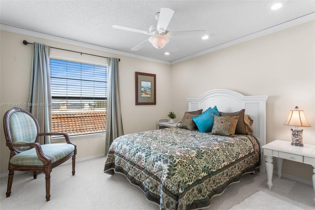 The GUEST BEDROOM is generously sized and versatile - ideal as a second bedroom, home office, or both.