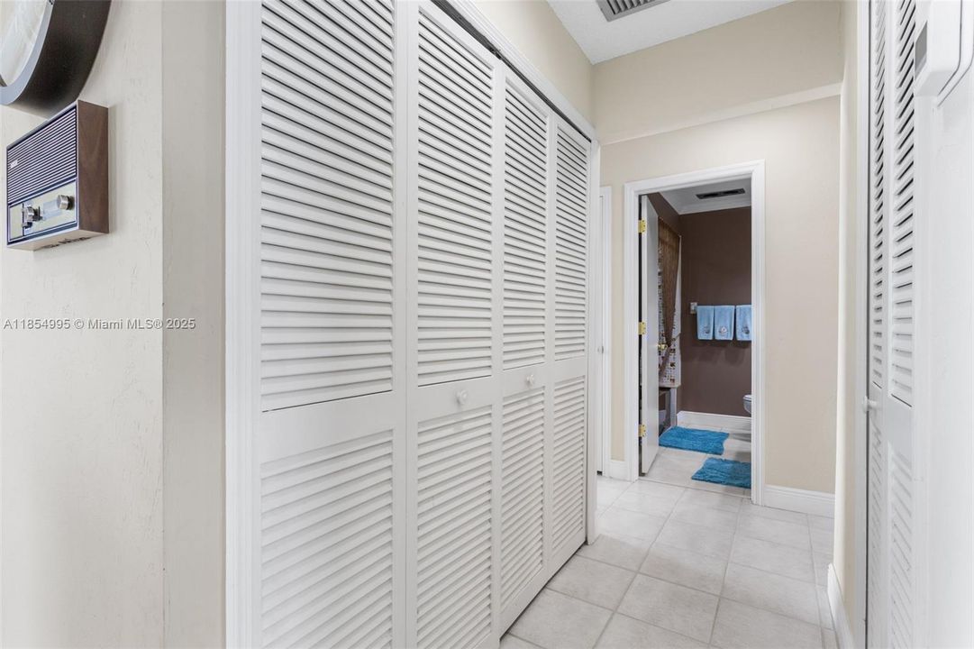 A full-sized washer and dryer are discreetly tucked inside for added convenience.