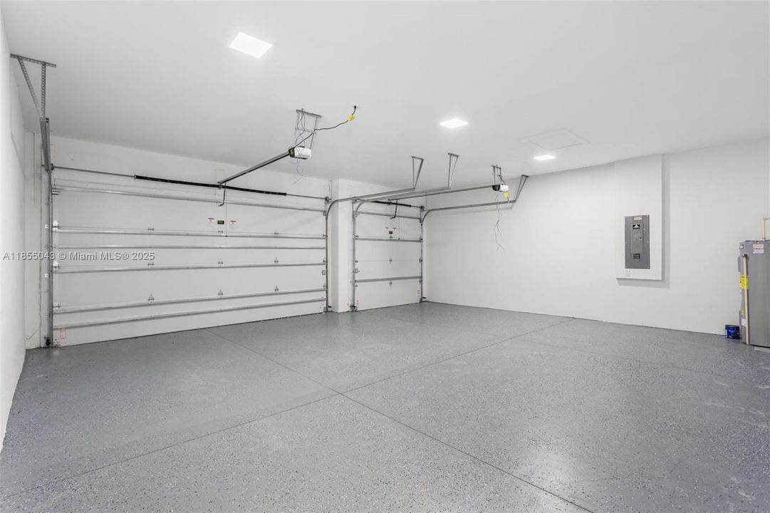 A 3-CAR GARAGE offers ABUNDANT ROOM for vehicles, storage, or weekend toys