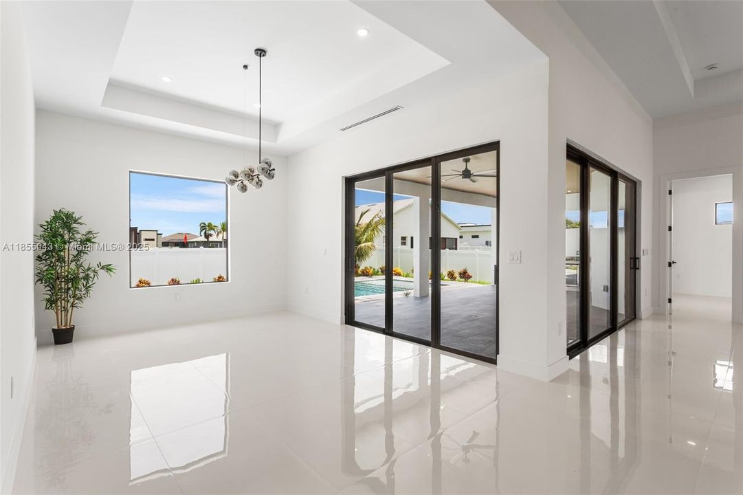 Formal Dining Room with impact resistant sliding doors to the lanai pool area