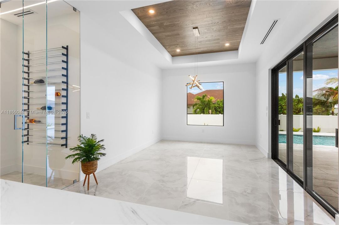 A HIGHLIGHT of the home is also the SPECTACULAR 55-bottle WINE RACK nestled within a DEDICATED WINE CLOSET, adding a TOUCH of LUXURY to your ENTERTAINING ENDEAVORS.