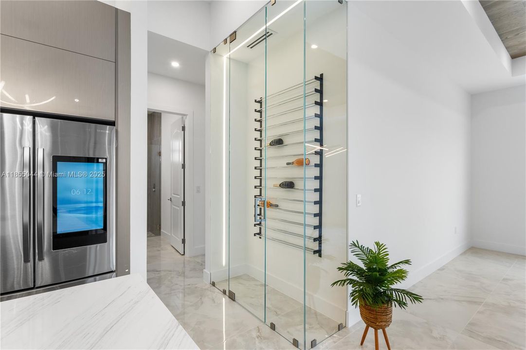 CUSTOM CABINETRY, QUARTZ COUNTERTOPS, a spacious FARMHOUSE SINK, and a sleek CHROME FAUCET with a pull-down SPRING SPOUT ELEVATE the CULINARY EXPERIENCE