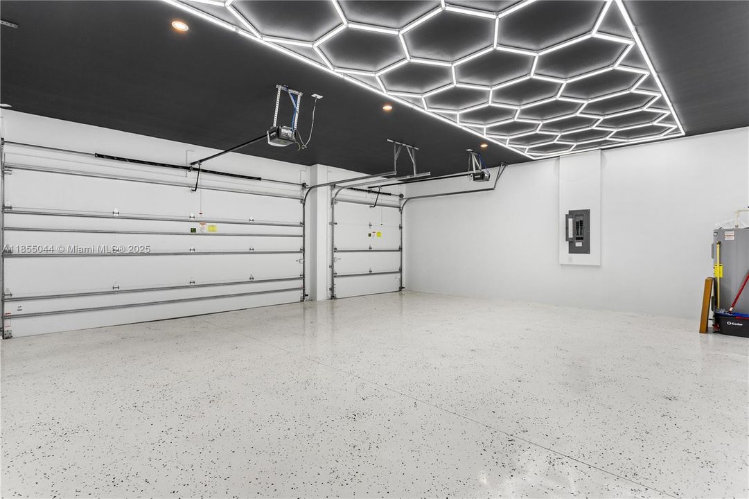 INSULATED GARAGE DOORS add EFFICIENCY and PRACTICALITY to this LUXURIOUS ABODE, ensuring COMFORT and CONVENIENCE year-round.