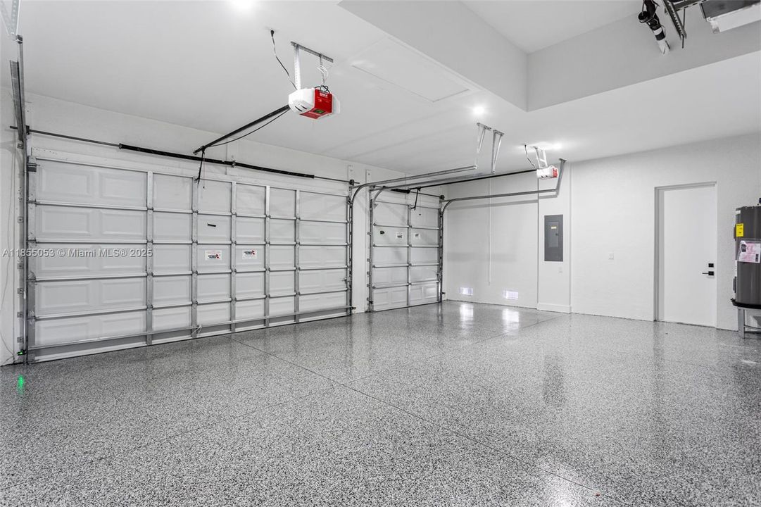 Spacious 3-CAR GARAGE provides plenty of room for vehicles, storage & hobbies, offering both CONVENIENCE & VERSATILITY.
