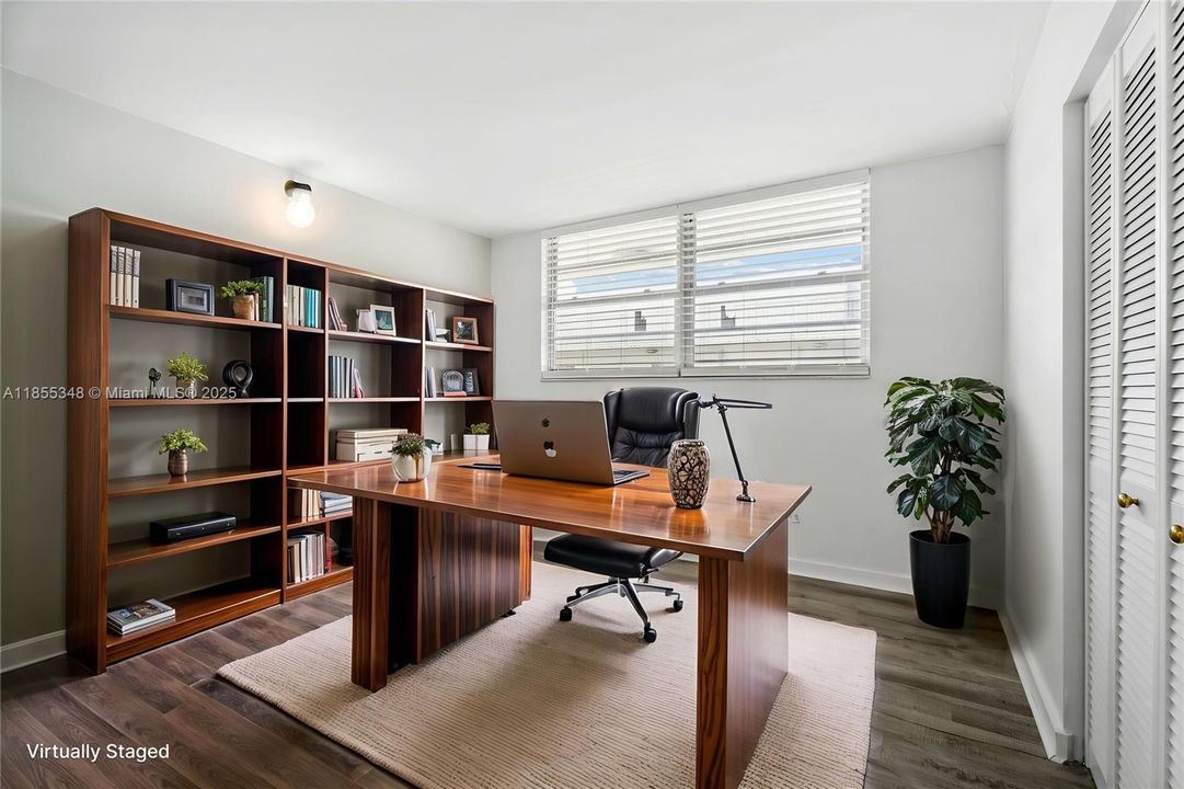 2nd bedroom virtually staged as a home office